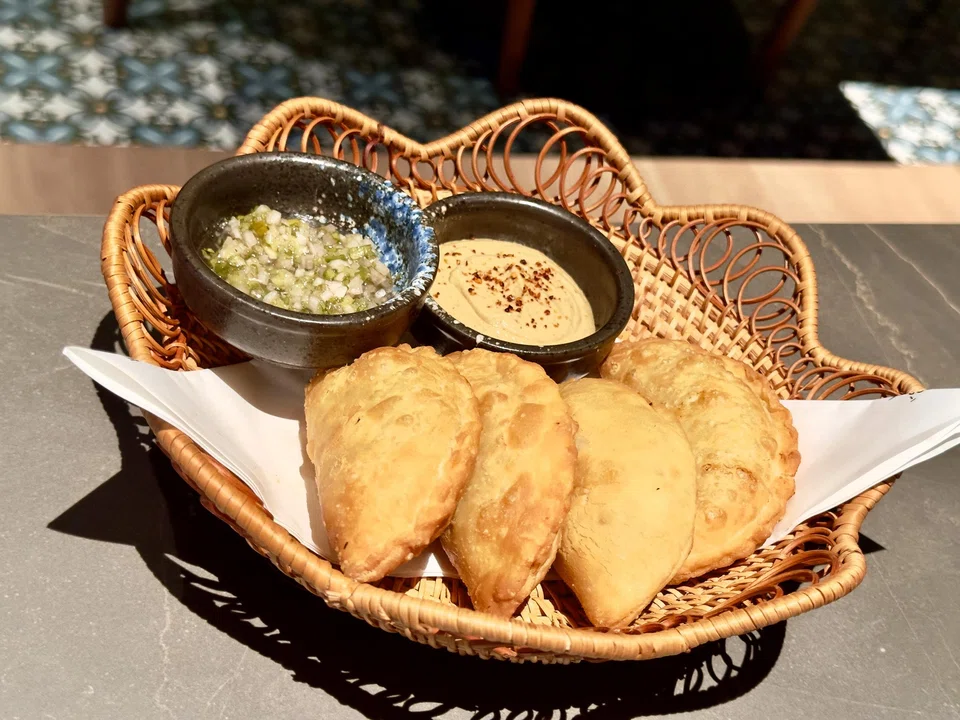 Empanadas are filled with a thick chicken and potato mixture.