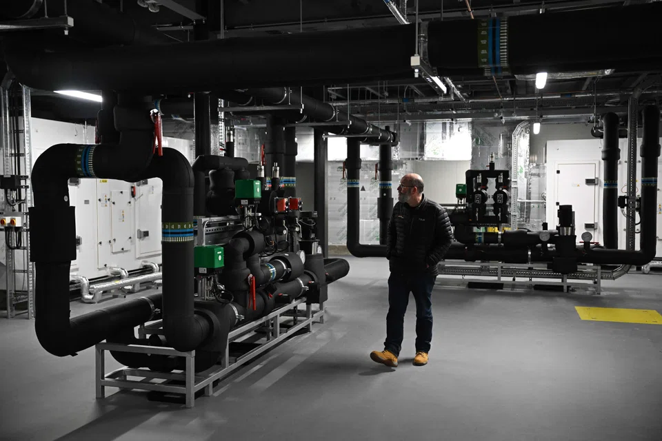 Professor William Swan walking through the "Pump Room", built to create temperatures and weather conditions ranging from minus 20 deg C to 40 deg C.