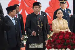 Indonesian president Joko Widodo (centre), president-elect Prabowo Subianto (left) and house speaker Puan Maharani leave parliament in Jakarta, Indonesia, Aug 16, 2024. Widodo will hand over the reins to Prabowo in October, departing with sky-high approval ratings over an economic track record that delivered consistent growth coming out of the Covid-19 pandemic.