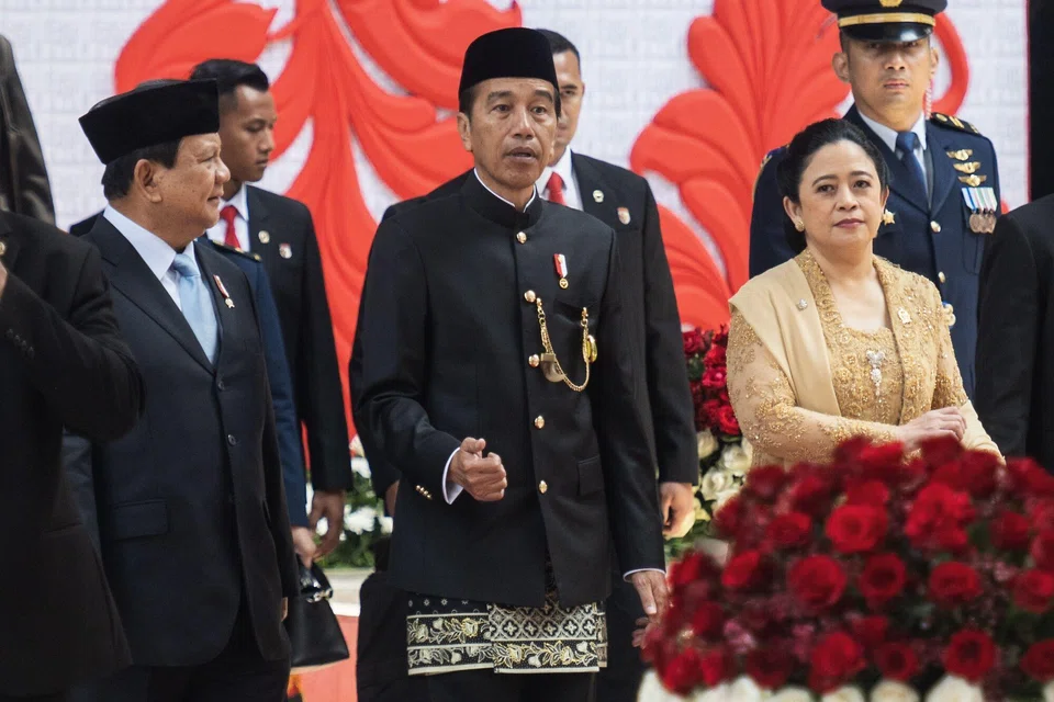 Indonesian president Joko Widodo (centre), president-elect Prabowo Subianto (left) and house speaker Puan Maharani leave parliament in Jakarta, Indonesia, Aug 16, 2024. Widodo will hand over the reins to Prabowo in October, departing with sky-high approval ratings over an economic track record that delivered consistent growth coming out of the Covid-19 pandemic.