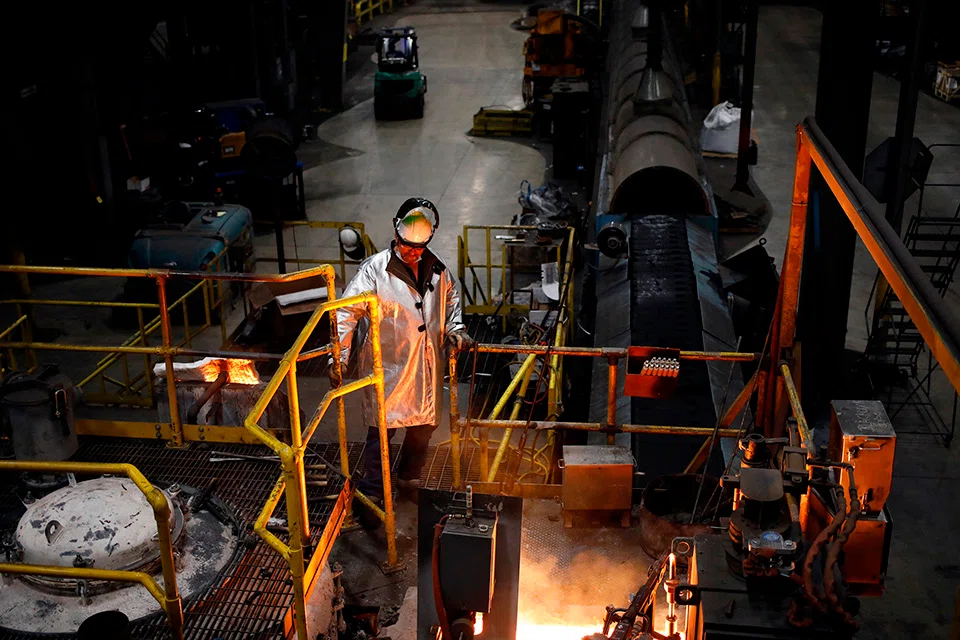 A worker oversee molten iron during cookware production at a factory in South Pittsburg, Tennessee. 