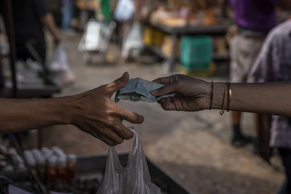 The baht has weakened to its lowest level since 2006, losing about 12 per cent this year.