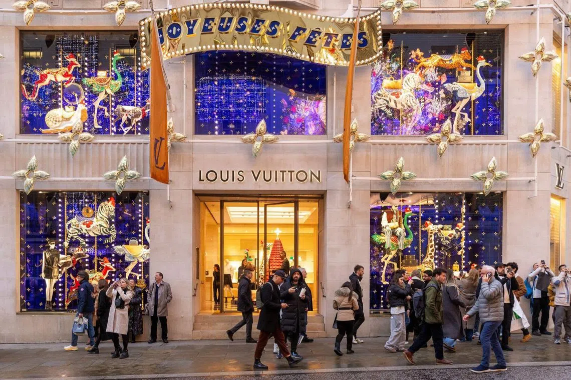 Pedestrians pass a Louis Vuitton luxury fashion store on New Bond Street in central London London, UK, on Thursday, Dec. 5, 2024. Demand for Christmas workers was barely higher in October than when Britain was in recession a year earlier, in a fresh sign of trouble for Europe’s second-largest economy. Photographer: Betty Laura Zapata/Bloomberg