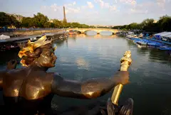 The view from the Alexandre III bridge in Paris.  The men’s triathlon begins with the athletes diving into the Seine from a pontoon next to the bridge.