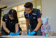 The money launderers held millions in cryptocurrency, bags from top brands and glitzy cars. Also in the mix, collectible statues known as BE@RBRICKs, golf club memberships and a Daniel Arsham x Dior Eroded Basketball sculpture worth US$13,333.