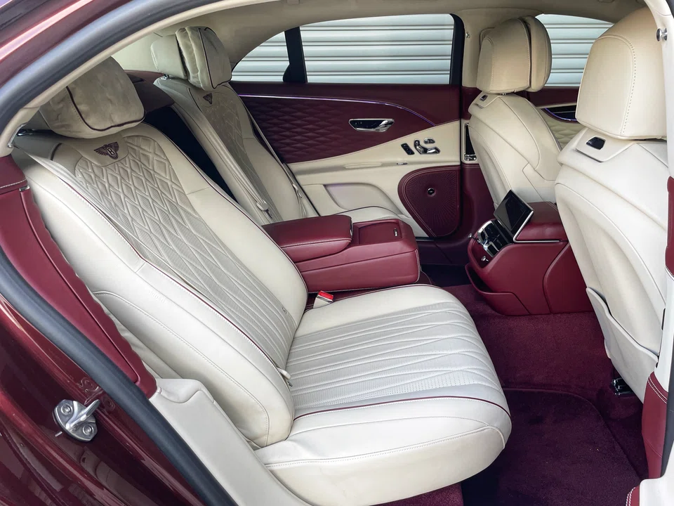 On the inside, reclining massage chairs, pillowy head cushions and a detachable touchscreen controller help to create a motoring experience that few cars offer.