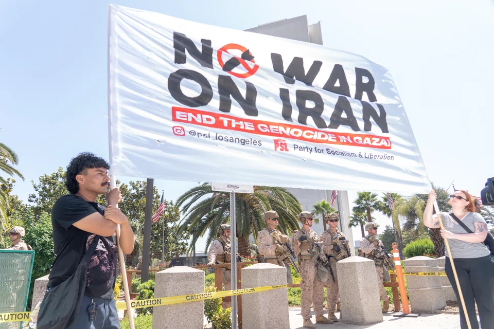 US Marines guard the Wilshire Federal Building during an anti-war protest following US and Israel's airstrikes on Iran, Los Angeles, California, June 22, 2025. US President Donald Trump said on Monday that a “complete and total” ceasefire between Israel and Iran will go into force with a view to ending the conflict between the two nations. 