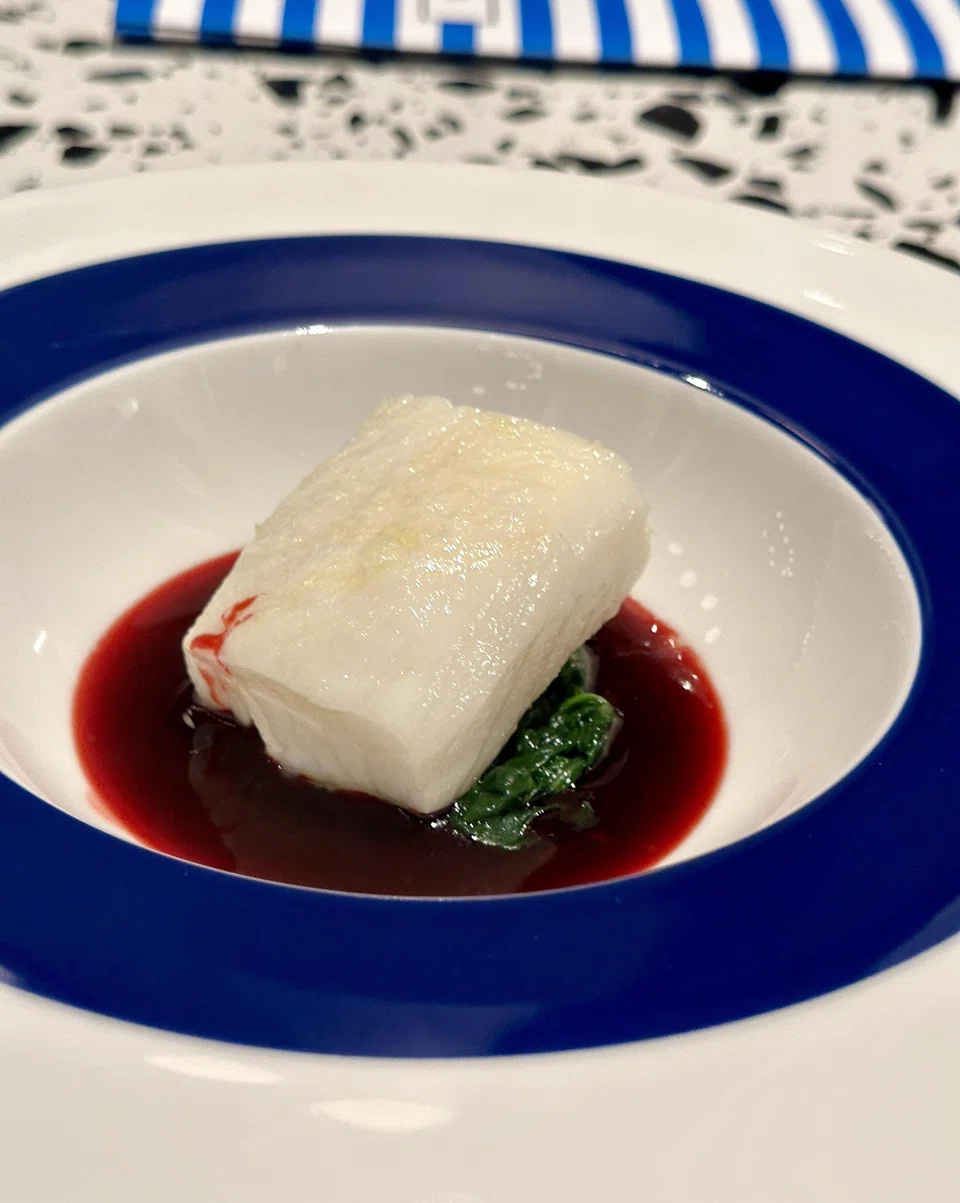 Succulent poached cod is served with a lemony beetroot sauce.