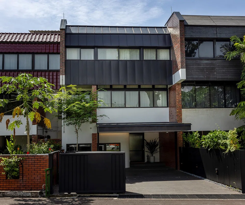 The Light House is an intermediate terrace house that's part of an original cluster of four staggered placement brick houses.