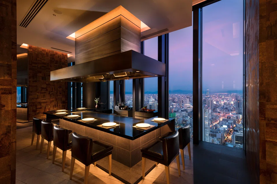 Kura serves teppanyaki with the city skyline as a backdrop.