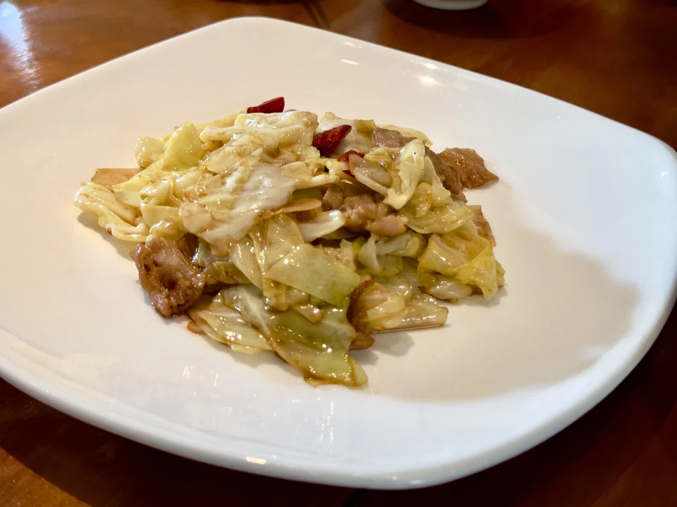 The stir-fried cabbage is a must-have.