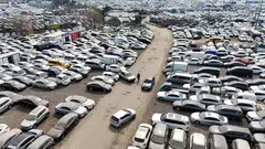 A drone view of used cars that are mostly exported to countries in the Middle East remain parked at a used-car export complex in Incheon, South Korea, on Mar 16.