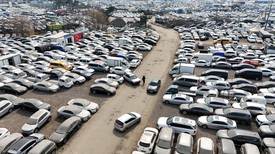 A drone view of used cars that are mostly exported to countries in the Middle East remain parked at a used-car export complex in Incheon, South Korea, on Mar 16.