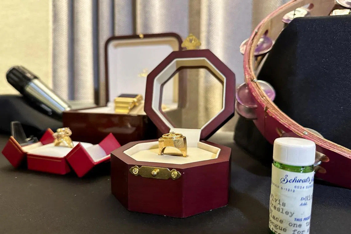 Elvis Presley's jewellery and pill bottle are displayed ahead of Artefacts of Hollywood & Music sale by GWS Auctions, in New York City on August 31.