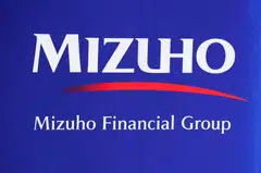 Japan’s third-largest lender Mizuho Financial Group posted a record annual profit of 885 billion yen (S$7.9 billion) as the end of deflation proved a boon for Japan’s largest banks, although its fourth-quarter net profit fell 18%.