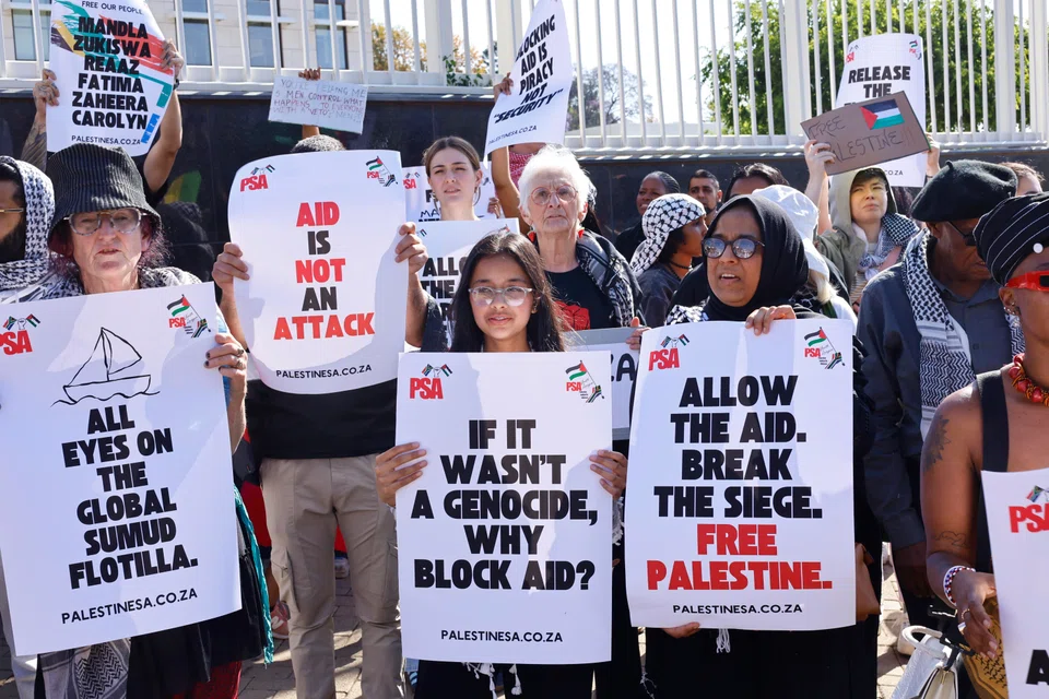 Protesters gather outside the United States embassay to protest against the arrest of South African MP Mandla Mandela and other activists onboard various boats off Gaza, in Johannesburg, South Africa, Oct 3 2025.  Hamas said that it had agreed to release all of the Israeli hostages held in Gaza as well as the bodies of those who had died, in response to the peace proposal introduced by President Donald Trump earlier this week. 