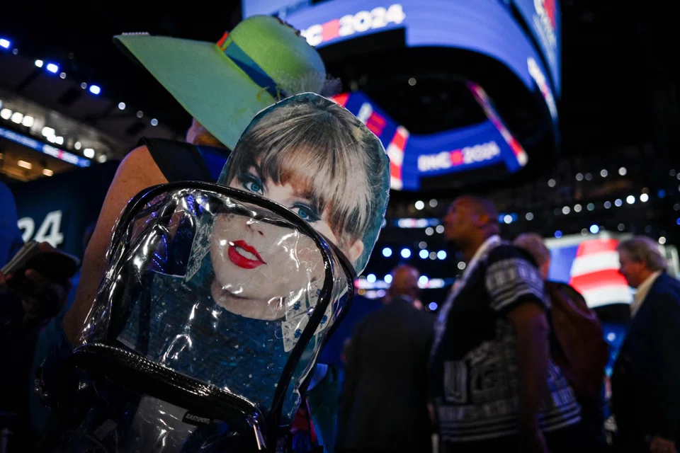  An attendee wears a backpack with a Taylor Swift sign during the third day of the Democratic National Convention at the United Centre in Chicago, Illinois, Aug 21, 2024.