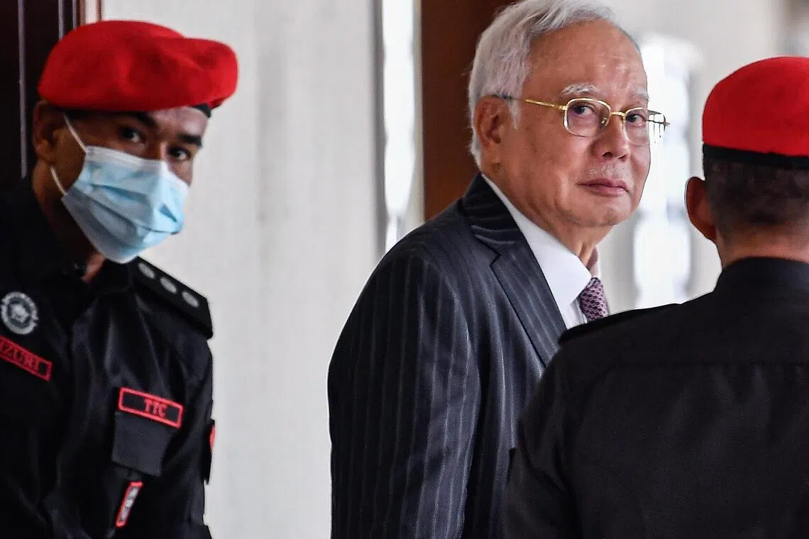 High Court judge Ahmad Fairuz Zainol Abidin ruled that Najib (top) breached his fiduciary duties, abused his position as prime minister, and misappropriated SRC funds for personal gain.