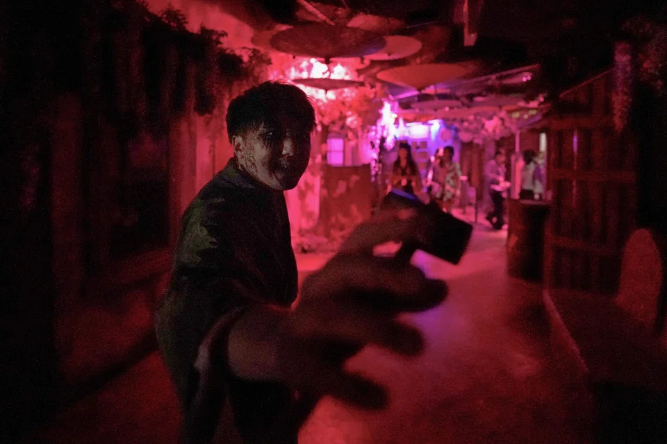 A kimono-clad performer acting like a zombie in a haunted house at the Namjatown indoor theme park in Tokyo.