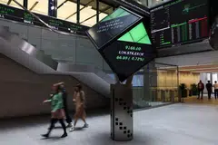 The benchmark FTSE 100 index rose 0.4 per cent to 8,390.76 points, hitting a new peak, while the mid-cap FTSE 250 reversed course to gain 0.2 per cent.