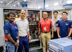 Members of deep tech spin-off Amperesand with the solid state transformer prototype developed at NTU's Energy Research Institute. 