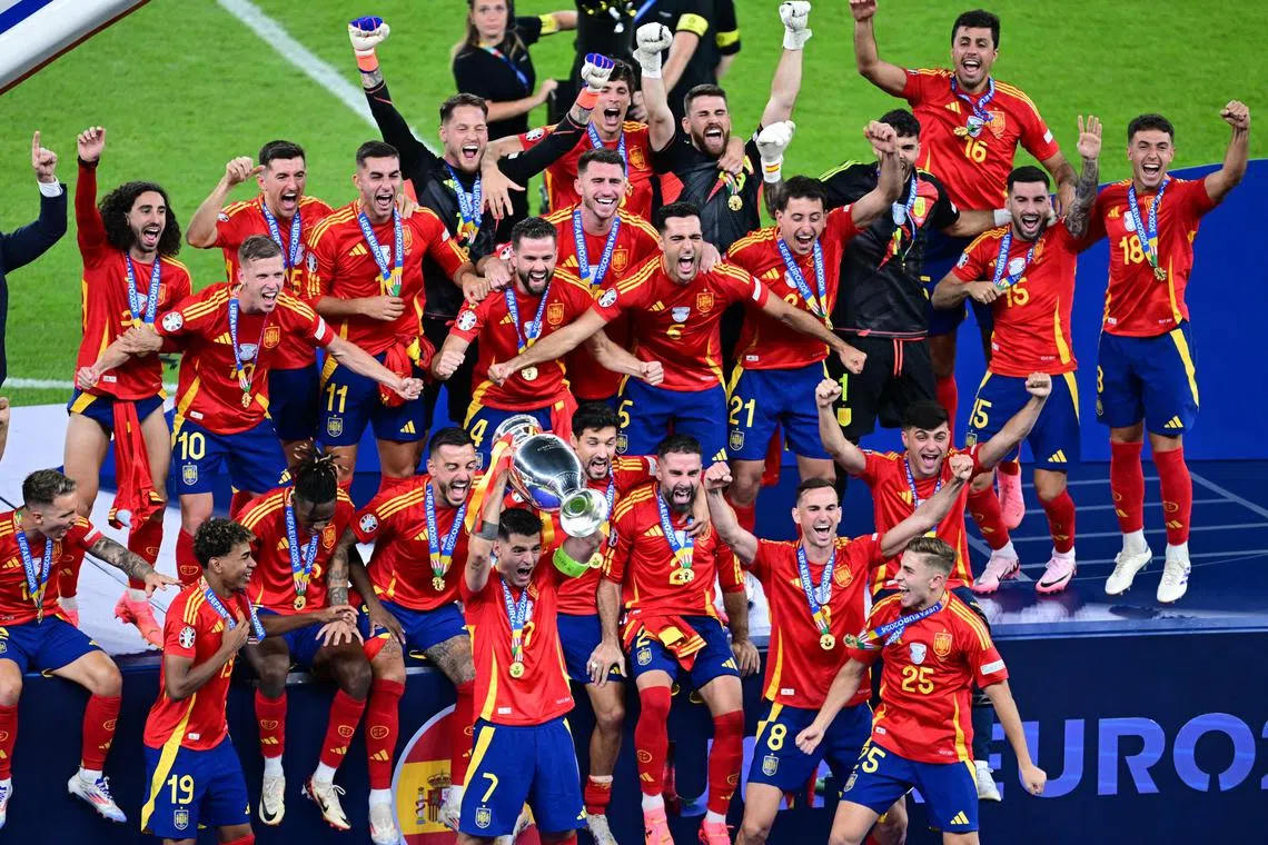 Spain's captain Alvaro Morata celebrates with teammates after winning Euro 2024, Berlin, Germany, July 14, 2024.