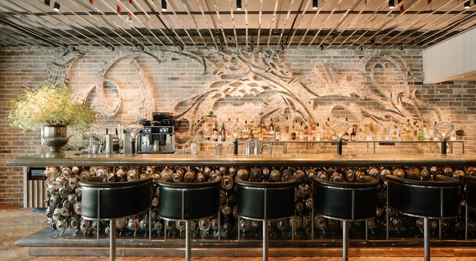 A bar at private club 1880 designed using over 300 teapots from England. 