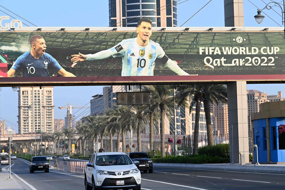 A billboard featuring France's striker Kylian Mbappe (L) and Argentine's captain Lionel Messi in Doha, Nov 2022, ahead of the Qatar 2022 FIFA World Cup football tournament. 