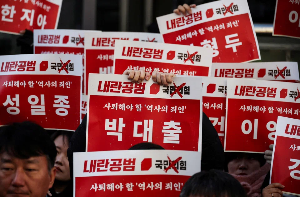 Protesters attend a rally calling for the impeachment of President Yoon Suk Yeol in front of the headquarters of the ruling People Power Party in Seoul, South Korea, Dec 9, 2024. 
