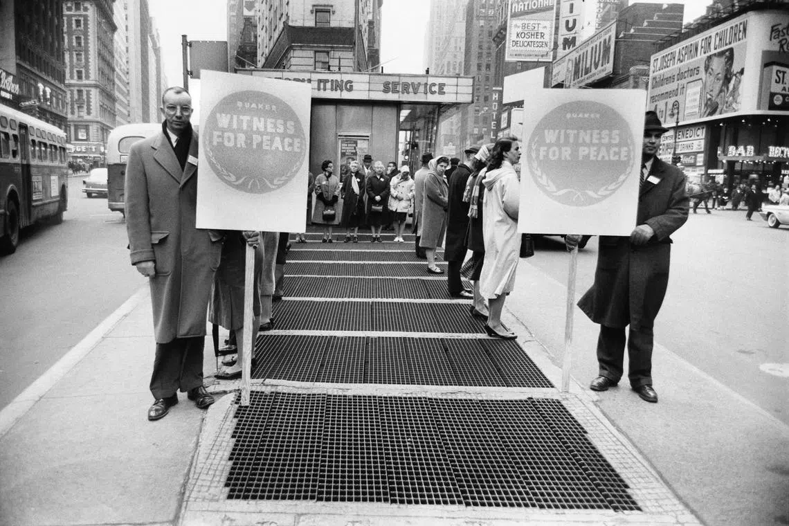 Quakers at a prayer vigil in front of the armed forces recruitment booth in Times Square, New York City, in 1961.