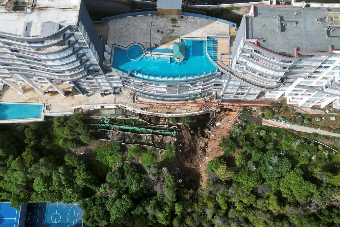 Intense rains that have lashed Chile in recent days caused a giant sinkhole to open underneath this high-end property in the resort city of Vina del Mar, prompting the evacuation of hundreds of residents.