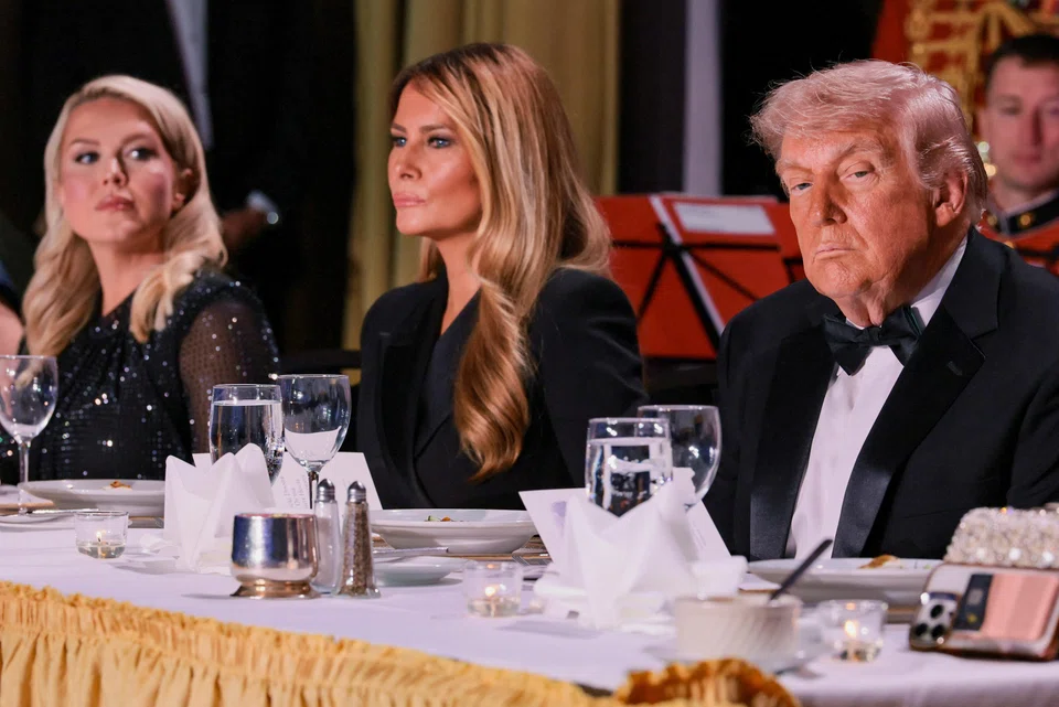 US President Donald Trump (right) and First Lady Melania Trump (centre) attend the annual White House Correspondents' Association dinner in Washington on Apr 25.