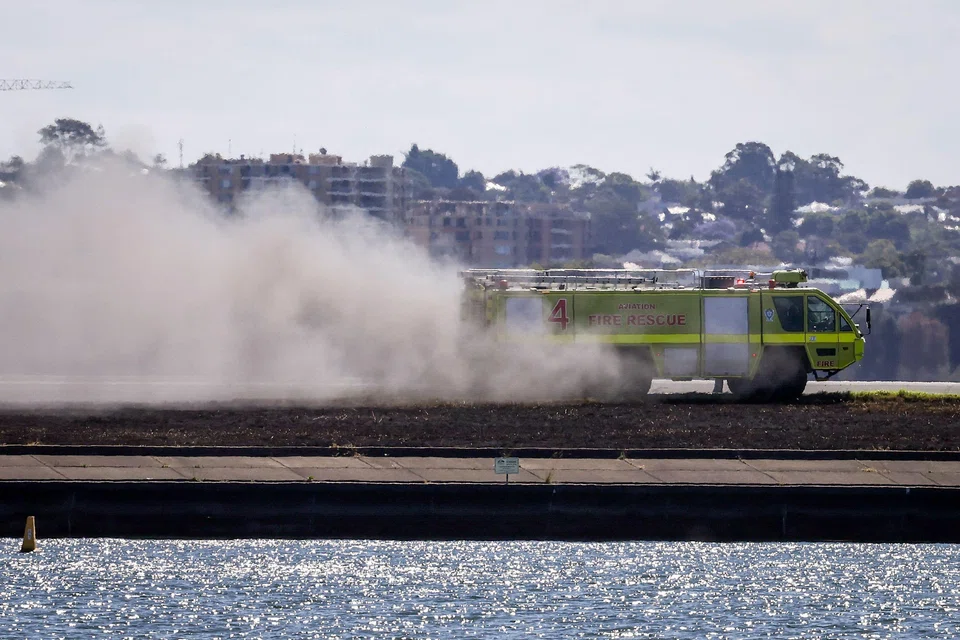 The aircraft’s departure coincided with a grass fire breaking out alongside Sydney Airport’s parallel runway (top). It’s not clear at this stage if the two incidents are linked and investigations are continuing.