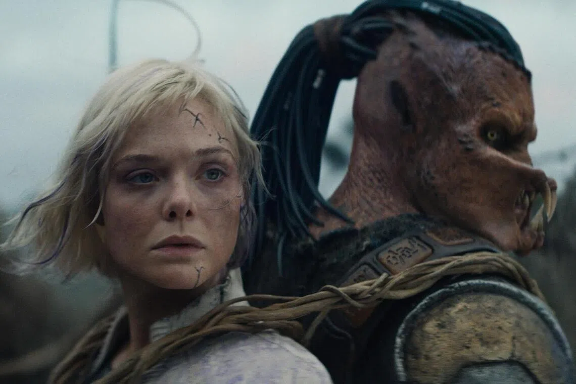 'Predator: Badlands' stars (from left) Elle Fanning as Thia and Dimitrius Schuster-Koloamatangi as Dek.