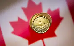 The loonie was trading 0.2 per cent lower at 1.3575 to the US dollar.