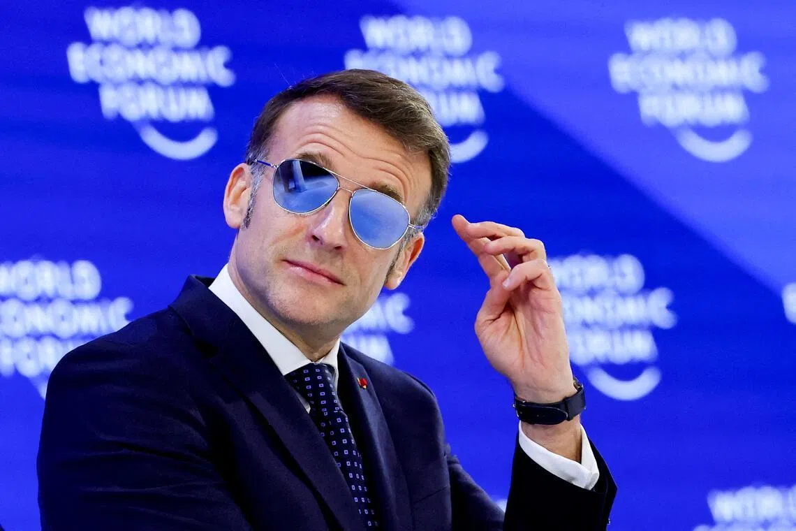 France's President Emmanuel Macron’s office said the choice to wear sunglasses was to protect his eyes because of a burst blood vessel.
