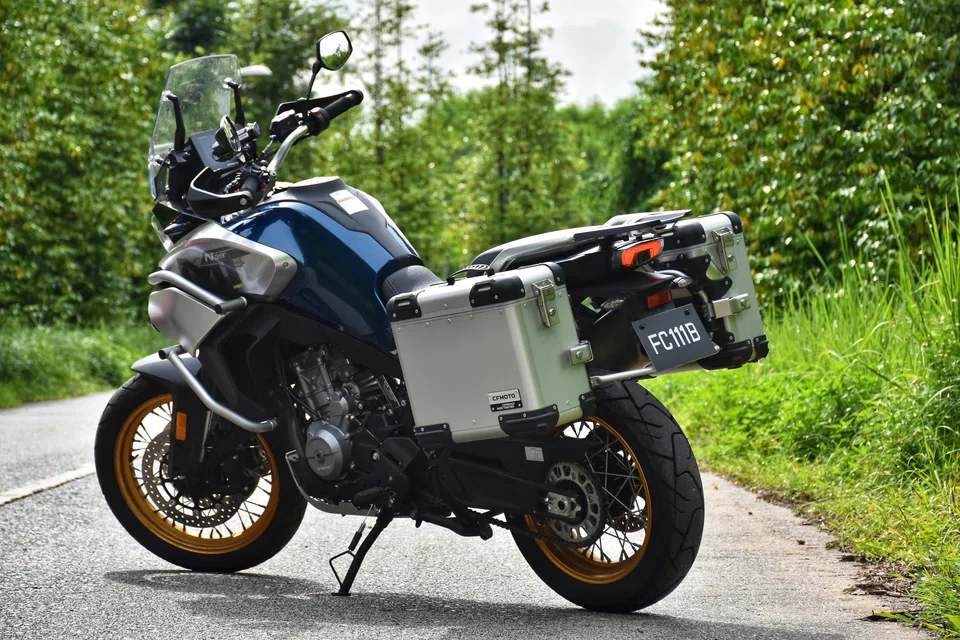 Two modest aluminium panniers and a top box take care of luggage, while an adjustable windscreen, cruise control and a tyre pressure monitoring system all help the bike live up to the “Tourer” part of its name.
