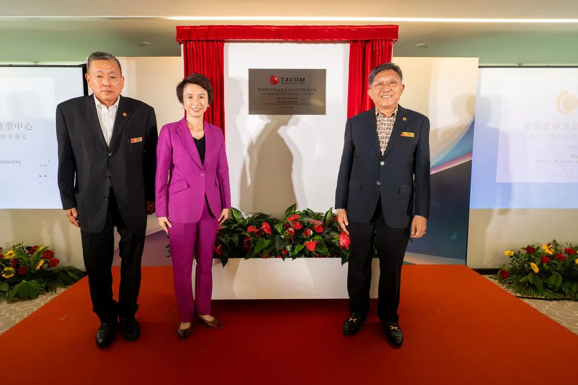 From left: Tacom chairman and SCCCI core council member Thomas Pek, Senior Minister of State for Trade and Industry Low Yen Ling, and SCCCI president Kho Choon Keng at the unveiling of the new centre's plaque.