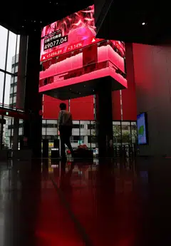 The Nikkei 225 jumped 3.4% to close at a record 49,185.50, while the broader Topix rose 2.5%.