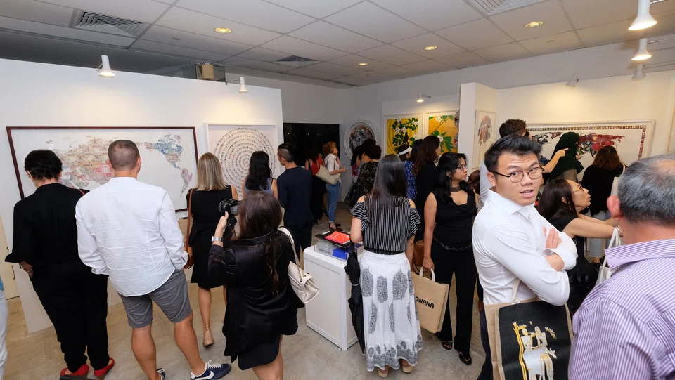 Visitors at the Affordable Art Fair 2017 held at the F1 Pit Building in November 2017. 