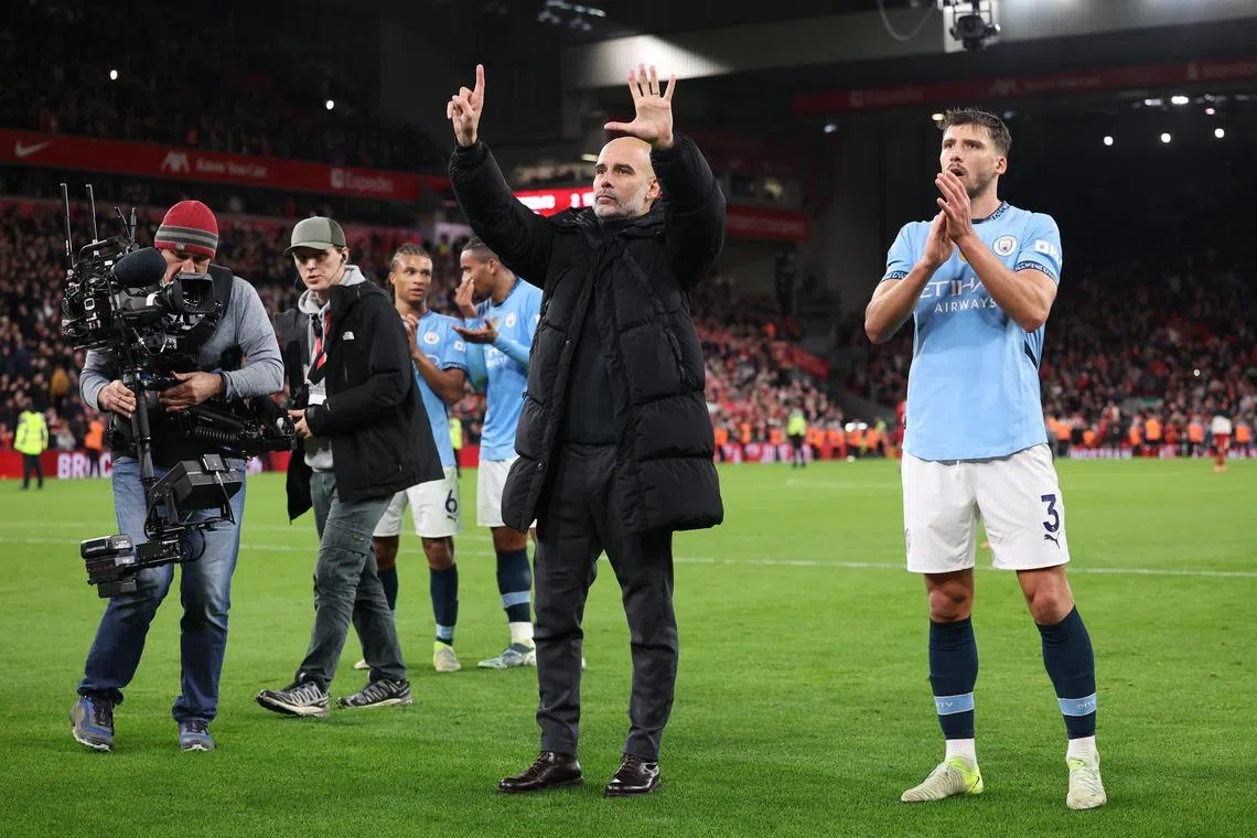 Manchester City manager Pep Guardiola gestures towards fans after the English Premier League match between Liverpool and Manchester City in Liverpool, England, Dec 1, 2024. 