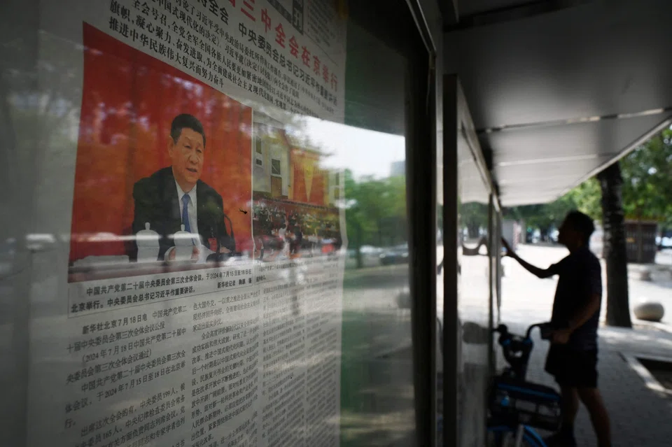 A newspaper featuring a story about the conclusion of the Third Plenum in Beijing. The meeting fell short of markets' expectations, with few concrete measures announced.