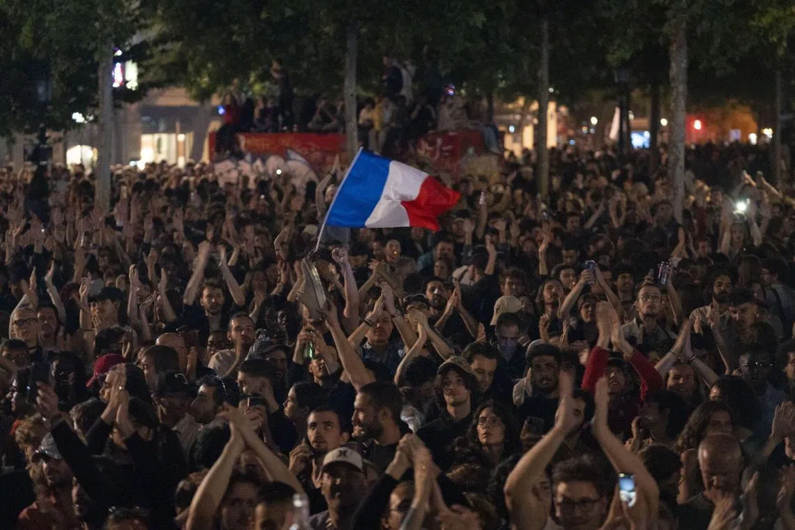 People gather to celebrate election results following voting in the second round of legislative elections in Paris, France, July 7, 2024.