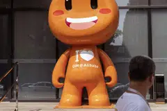 The mascot for Alibaba Group Holding Ltd.'s Taobao e-commerce platform in Hangzhou, China. China equities are attractive as there should be fewer disruptions to economic activity going forward.