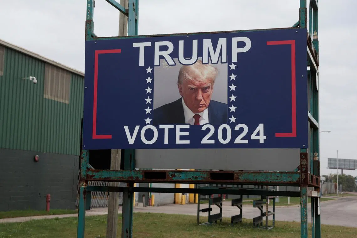 A sign in support of Republican presidential nominee and former U.S. President Donald Trump is seen in an industrial area of Detroit, Michigan, U.S., October 1, 2024.   REUTERS/Rebecca Cook