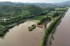 Flooded farmlands next to the overflowing Chao river, following heavy rainfall in Miyun district of Beijing, China, July 28, 2025. 