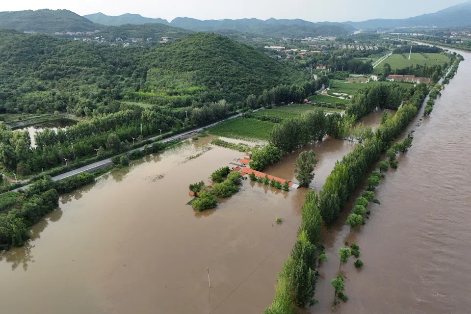 Flooded farmlands next to the overflowing Chao river, following heavy rainfall in Miyun district of Beijing, China, July 28, 2025. 