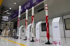 Models of space rocket carriers and engines at the LandSpace factory. China’s companies may, for the first time in their histories, successfully recover the first stage of a rocket, opening a galaxy of opportunity.