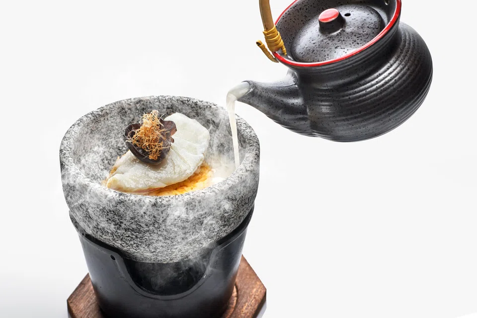 Egg-fried rice and cod fillet in a rich, milky fish stock.