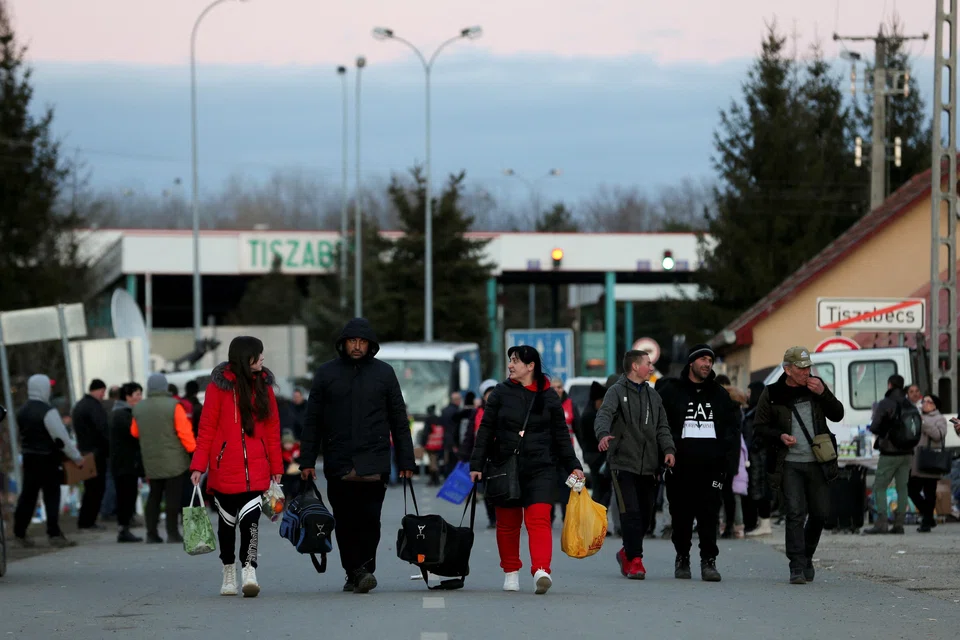 People fleeing from Ukraine at a border crossing in Hungary in February 2022. As at Nov 14, there are 6.3 million recorded Ukrainian refugees globally.